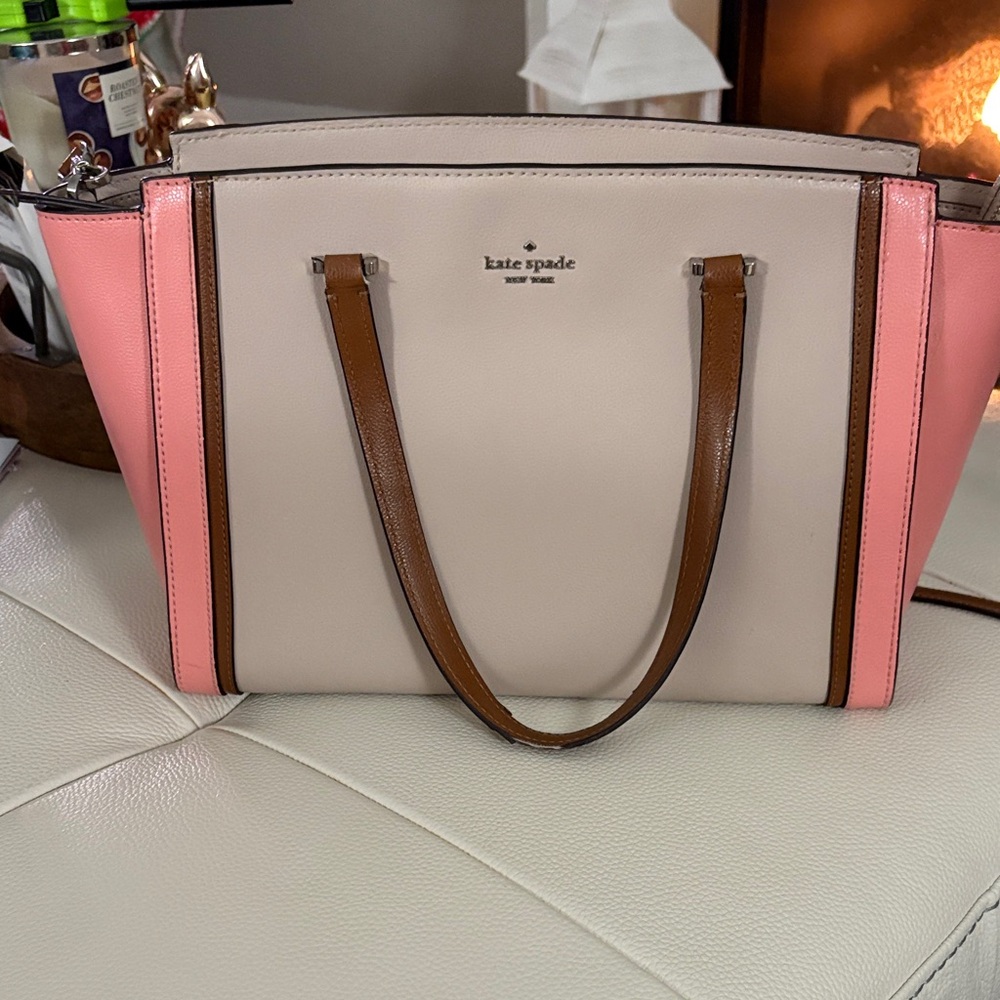 Kate Spade Beige and Pink Satchel
This is in nice condition . The zippers w/well